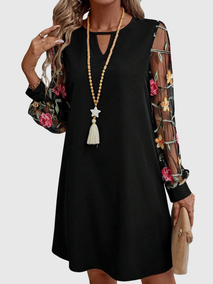 Jolanta | Elegancka sukienka z dekoltem w kształcie V i wyrazistymi rękawami